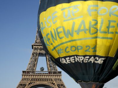 Greenpeace activists fly a hot air balloon depicting the globe next to the Eiffel Tower ahead of the 2015 Paris Climate Conference COP21